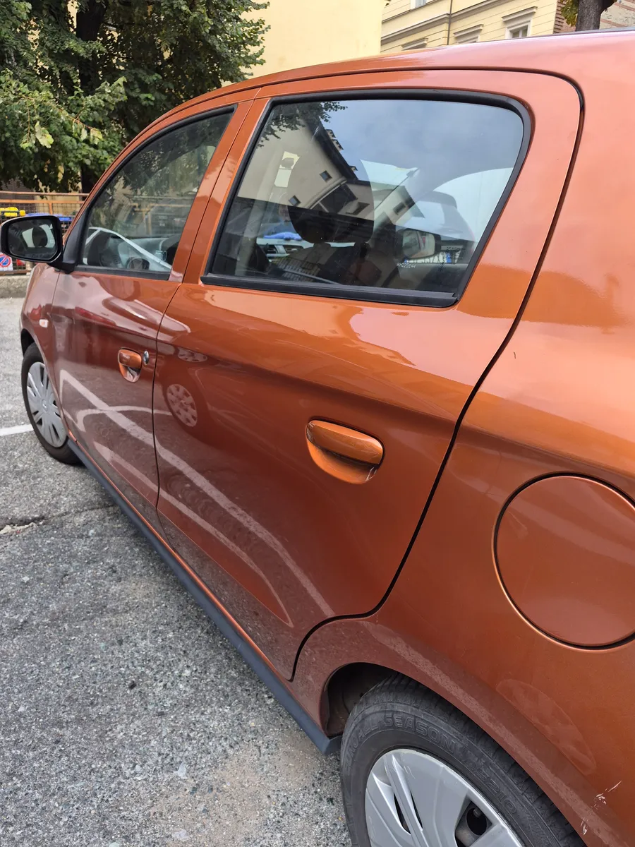 Dent on the rear door — After