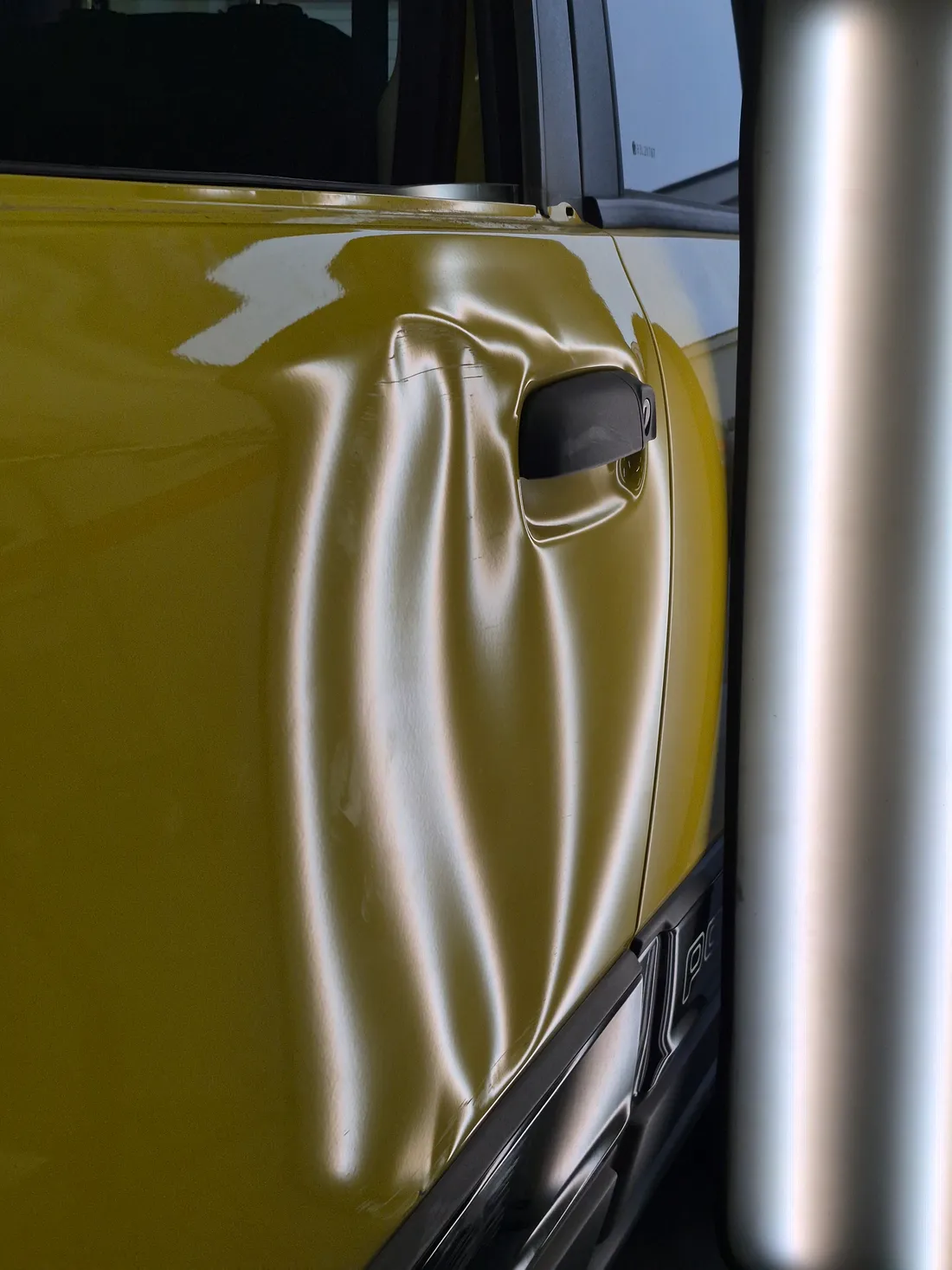 A door dent read with the PDR lamp